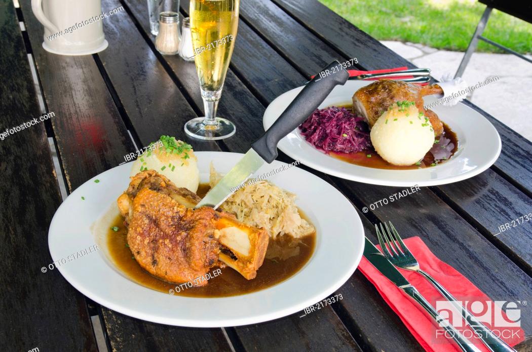 Stock Photo: Knuckle of port and a portion of roast duck, Bavarian food, Bavaria, Germany, Europe.