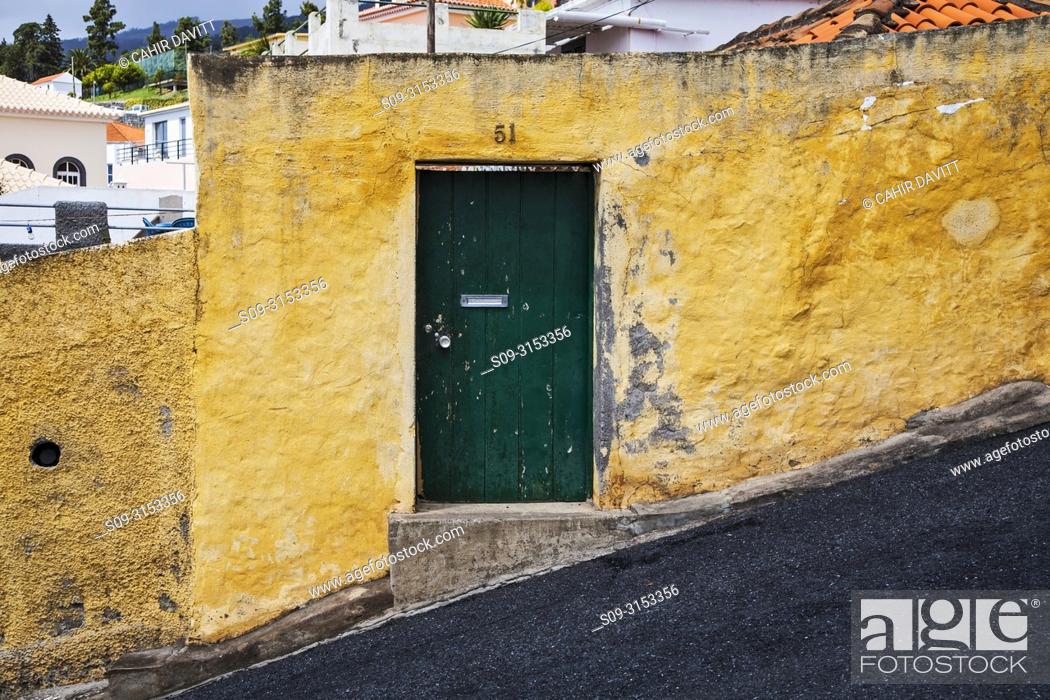 Stock Photo: Green entrance door to property located on Caminho do Meio, showing 18 degree steep street in the Terreiro da Luta suburb, Funchal, Ilha da Madeira, Portugal.