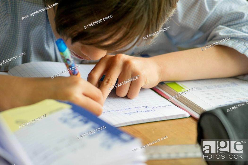 Photo de stock: Boy doing homework.