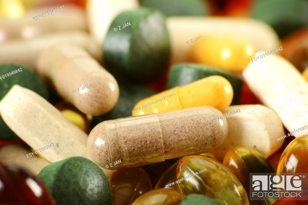 Stock Photo: Composition with dietary supplement capsules and tablets. Spirulina.