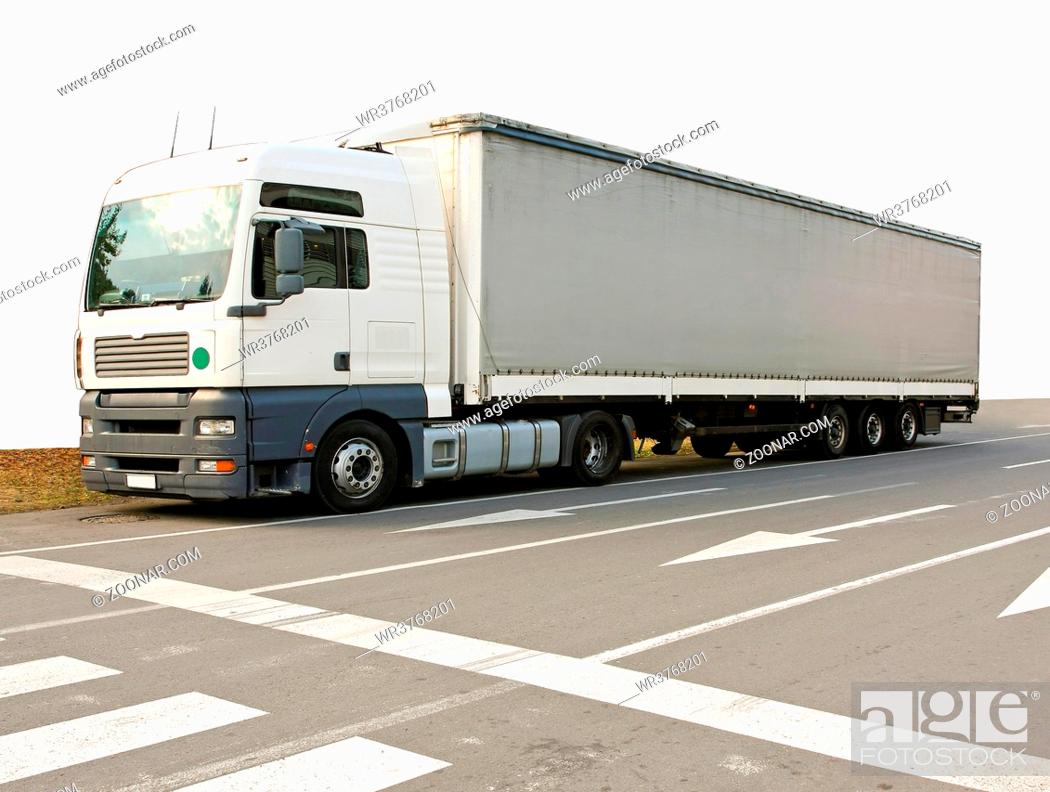 Stock Photo: Big and long semi truck at street.