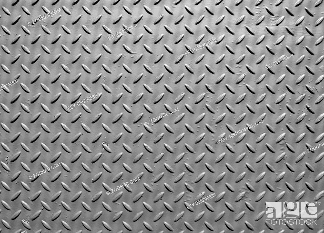 Stock Photo: grey steel metal plate with painted surface and industrial safety diamond pattern texture.