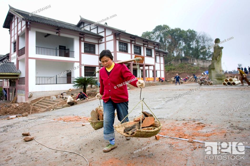 Stock Photo: Woman at work building new tourist centre at Dazu Rock Carvings, Mount Baoding, Chongqing, China.
