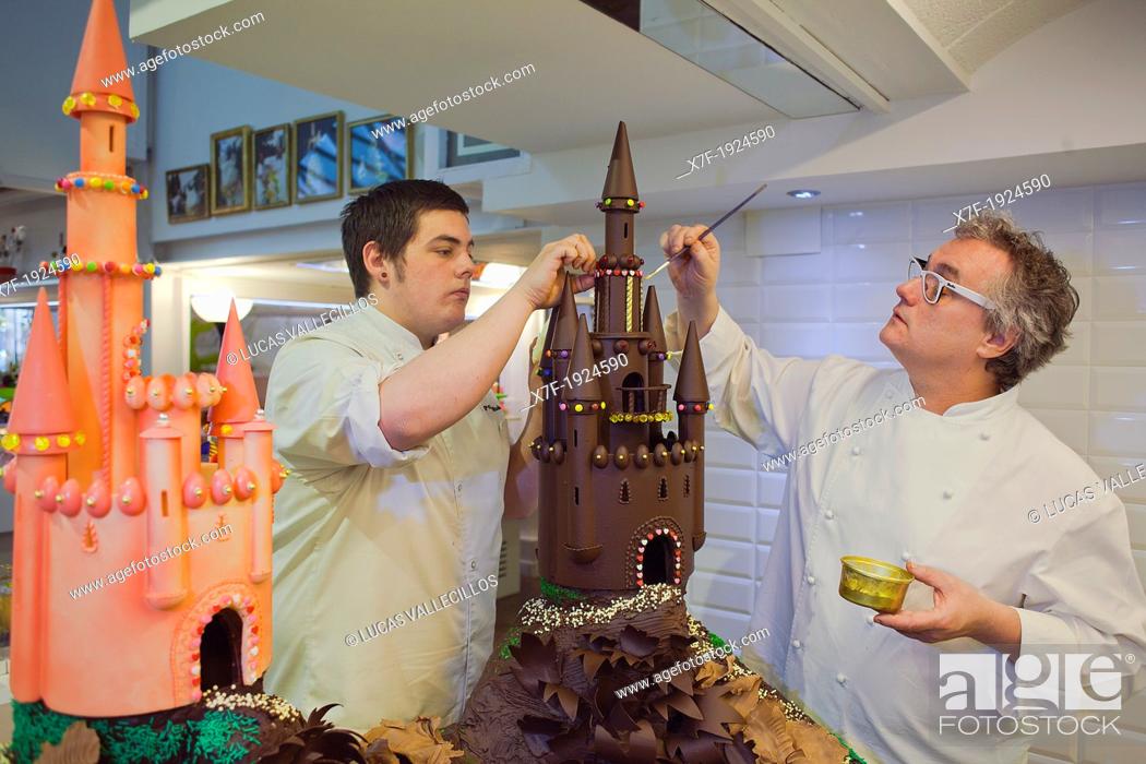 Stock Photo: Christian Escriba and his son making a `Mona', typical chocolate cake of Pascua's monday, the godfather gives his godson, catalan tradition, Escriba  bakery.