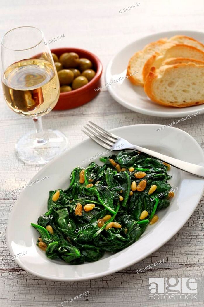Stock Photo: sauteed spinach with raisins and pine nuts, spanish catalan dish.