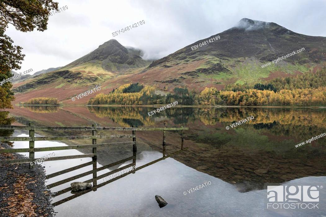 Stock Photo: Stunning Autumn Fall landscape image of Lake Buttermere in Lake District England.