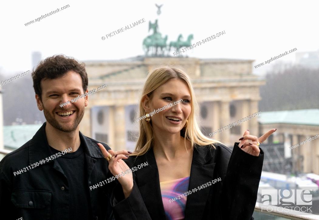 Stock Photo: 30 December 2021, Berlin: The band ""Glasperlenspiel"" with Daniel Grunenberg and Carolin Niemczyk stands on the terrace of the Academy of Arts in front of the.
