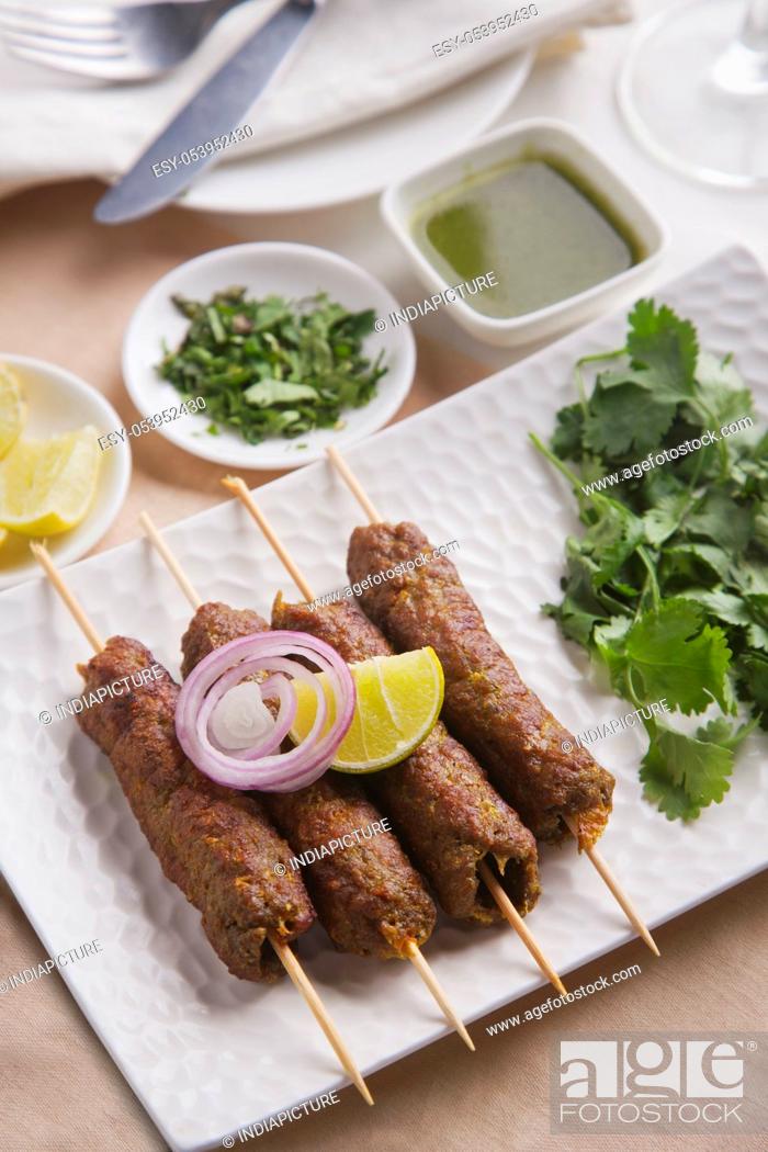 Stock Photo: High angle view of seekh kabab served in plate at table.