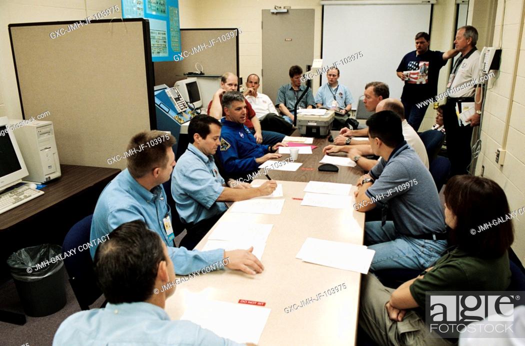 Stock Photo: The STS-108 crewmembers and the Expedition Four crew members share a joint planning session in the Space Vehicle Mockup Facility at Johnson Space Center (JSC).