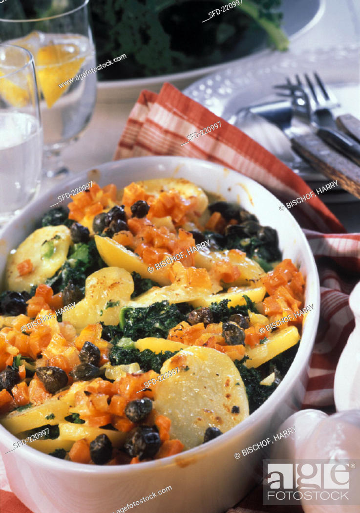 Stock Photo: Kale & potato bake with carrots and capers in baking dish.