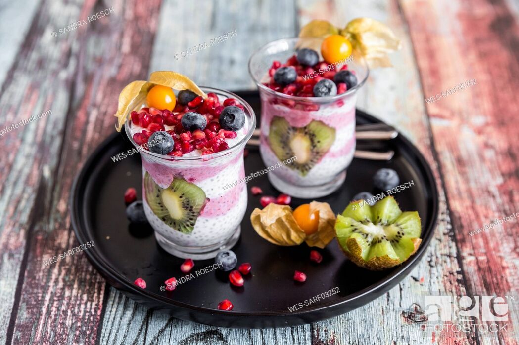 Stock Photo: Two glasses of chia pudding with several fruits.