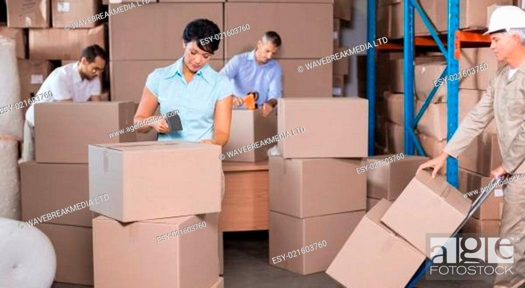 Stock Photo: Warehouse workers preparing a shipment.