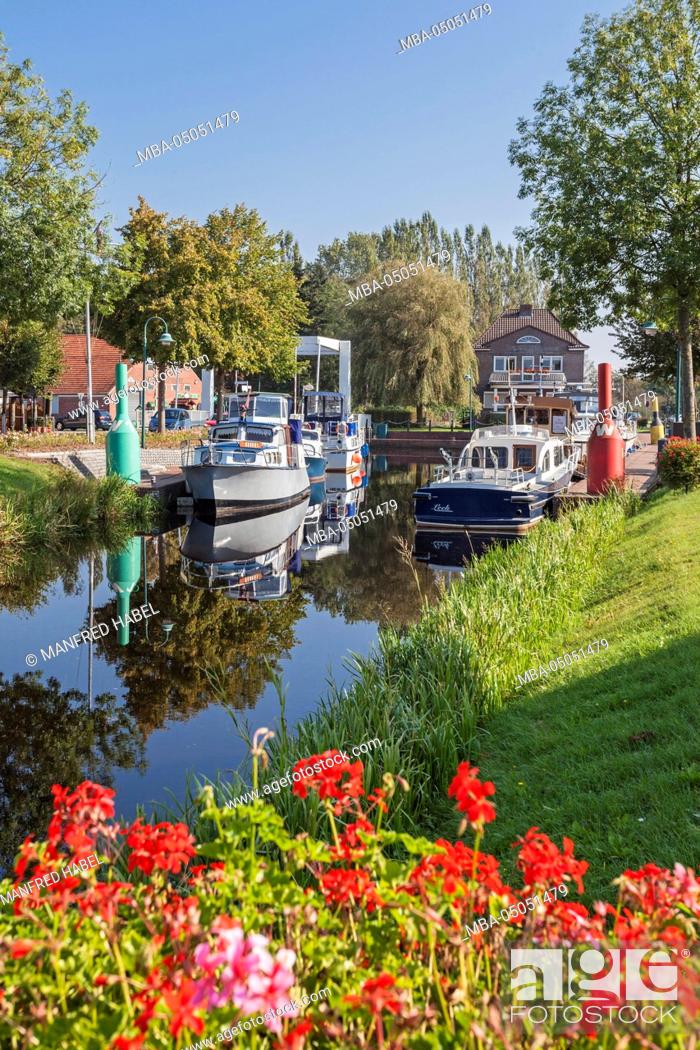Stock Photo: Jetty, motor ships, Westrhauderfehnkanal (canal), Rhauderfehn, Overledingerland, Eastern Frisia, Lower Saxony, Germany.