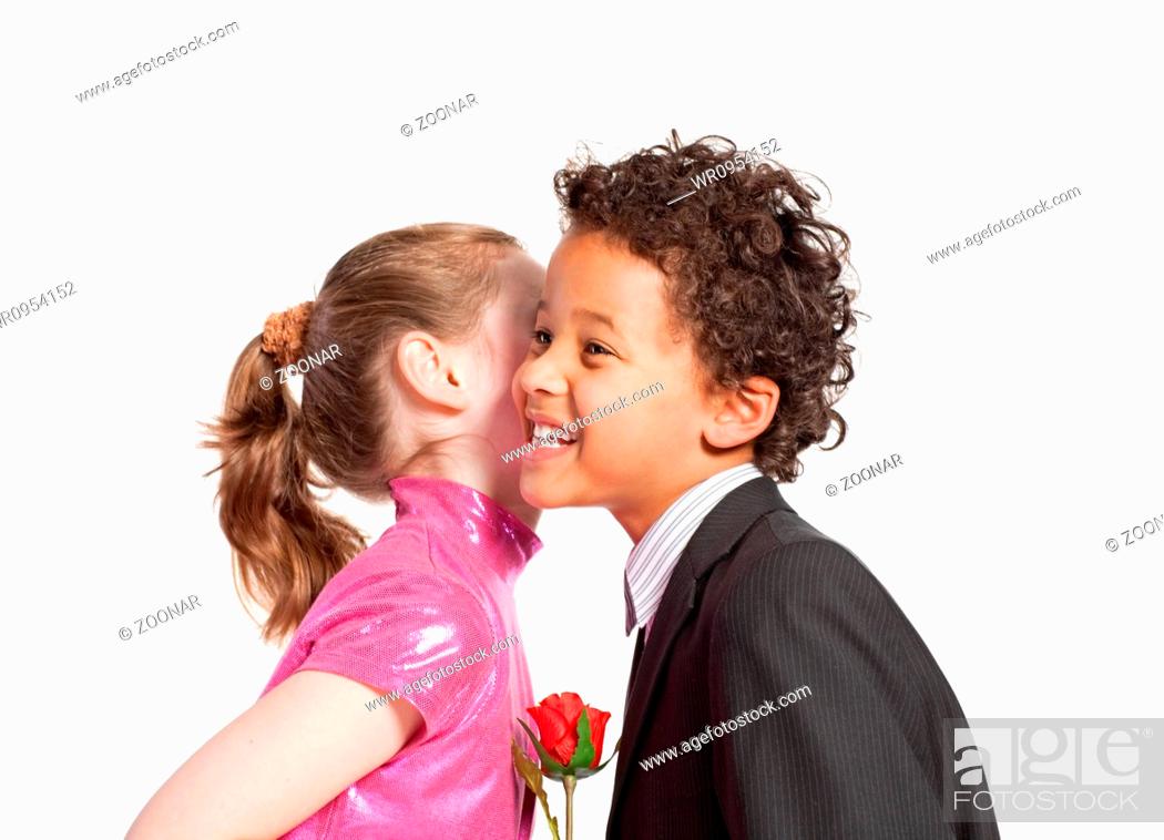 Cute little girl kissing a boy, Stock Photo, Picture And Royalty Free  Image. Pic. WR0954152 | agefotostock