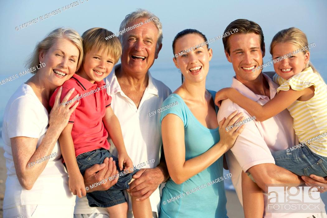 Imagen: Portrait Of Three Generation Family On Beach Holiday.