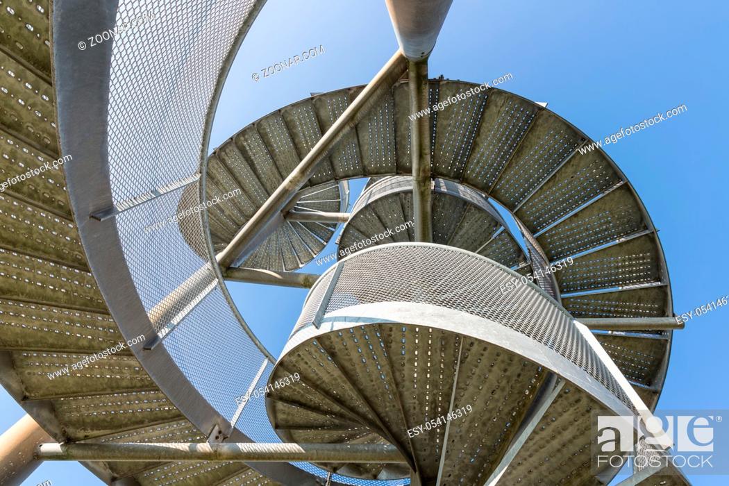 Stock Photo: Detail of watch tower made of two twisted steel spiral staircases near Lelystad Airport in The Netherlands.