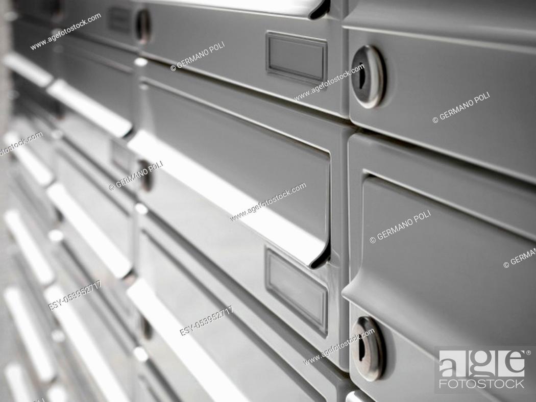 Stock Photo: Modern Gray Mailboxes. They can be used for background and concepts. Shallow depth of field.
