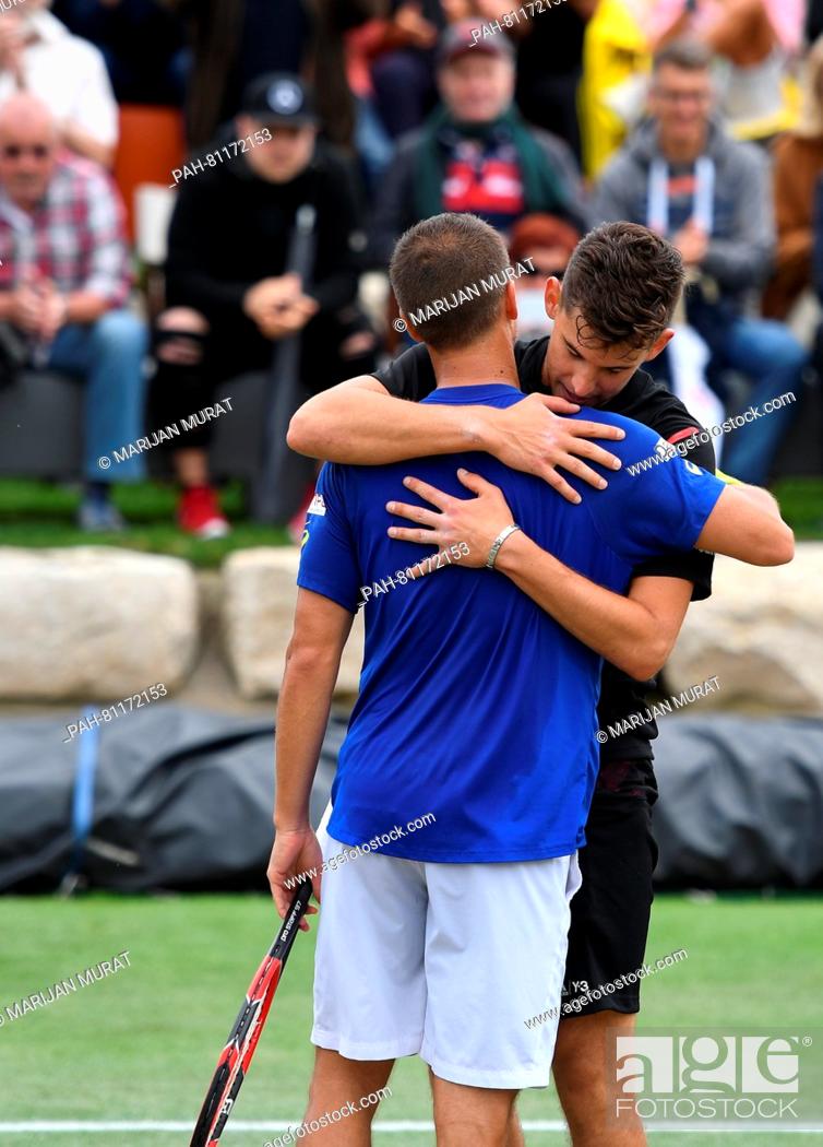 Stock Photo: Dominic Thiem of Austria and Philipp Kohlschreiber of Germany hug each other after the ATP tournament in Stuttgart, Germany, 13 June 2016.