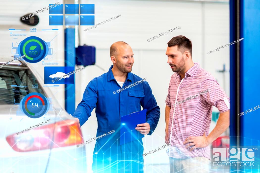 Stock Photo: auto mechanic with clipboard and man at car shop.