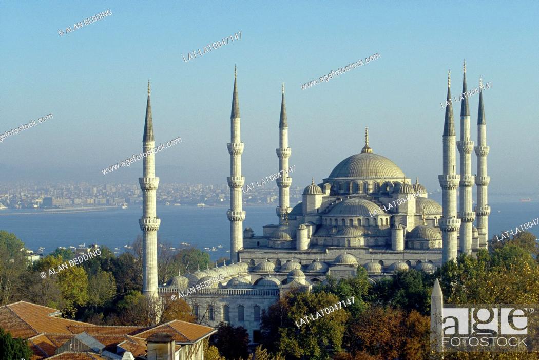 Stock Photo: Sultan Ahmet Camii. Blue mosque. Six tall thin towers. Domes. Overlooking water and city.