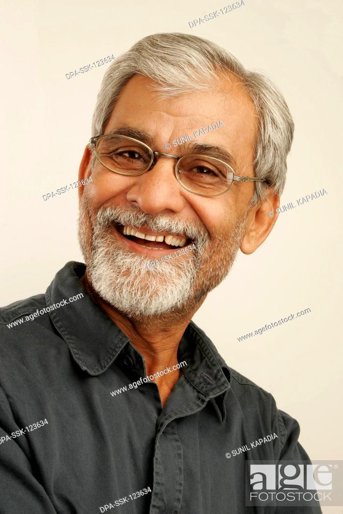 South Asian Indian old man late fifties with gray hair and beard wearing  dark blue shirt and..., Stock Photo, Picture And Rights Managed Image. Pic.  DPA-SSK-123634 | agefotostock