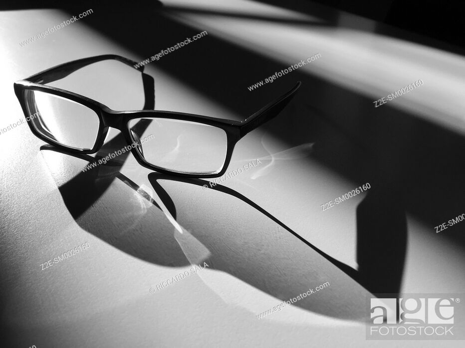 Stock Photo: Glasses in the Light and Shadows. . .