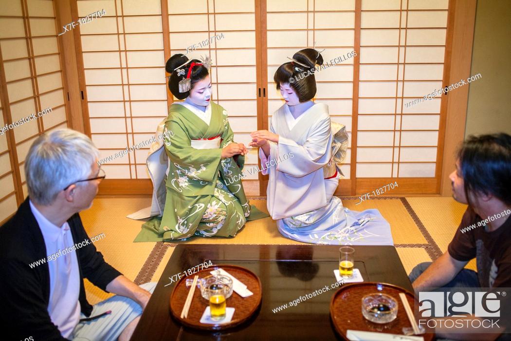 Stock Photo: Fukuyu, geisha and Fukukimi, 'maiko' geisha apprentice workimg in Miyaki tea house o-chaia Geisha's distric of Miyagawacho Kyoto  Kansai, Japan.