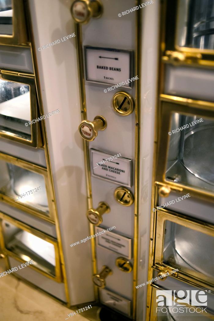 Stock Photo: A recreation of the famous Horn & Hardart Automat using original preserved machinery in the Lunch Hour NYC show at the New York Public Library in the Schwarzman.