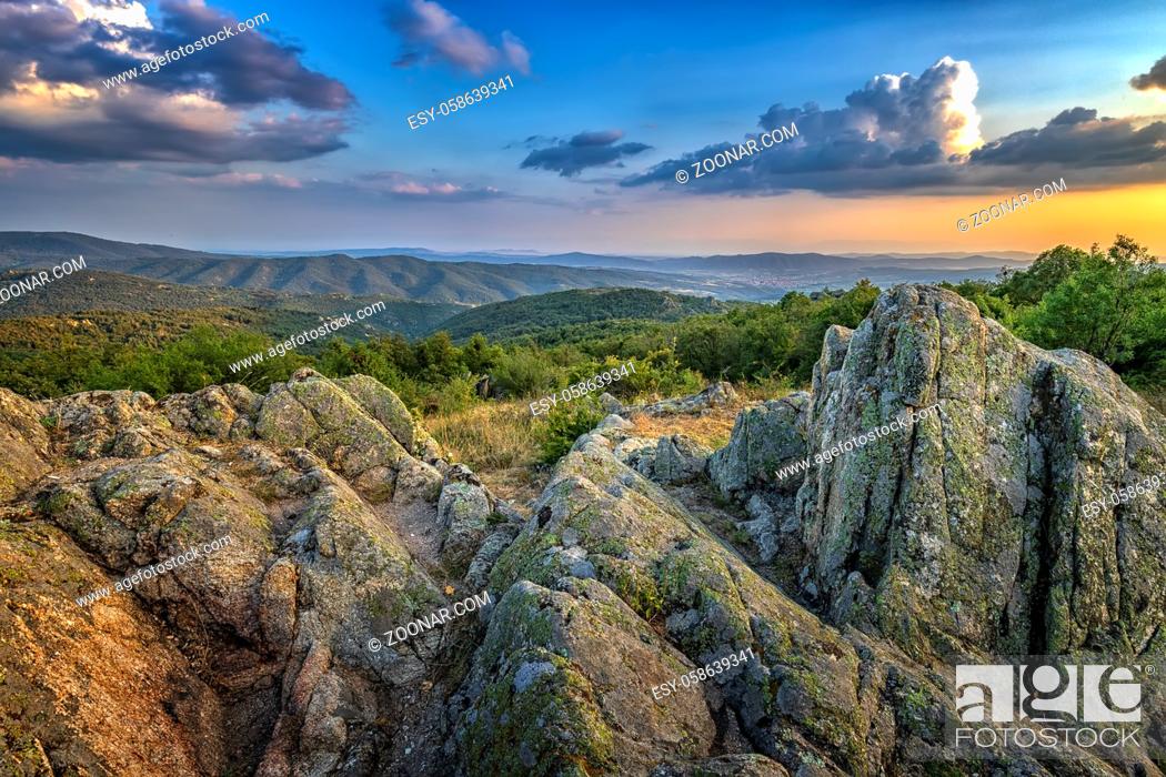 Stock Photo: Amazing rocks on the edge of a mountain. Beautiful summer landscape of mountains at sunset.