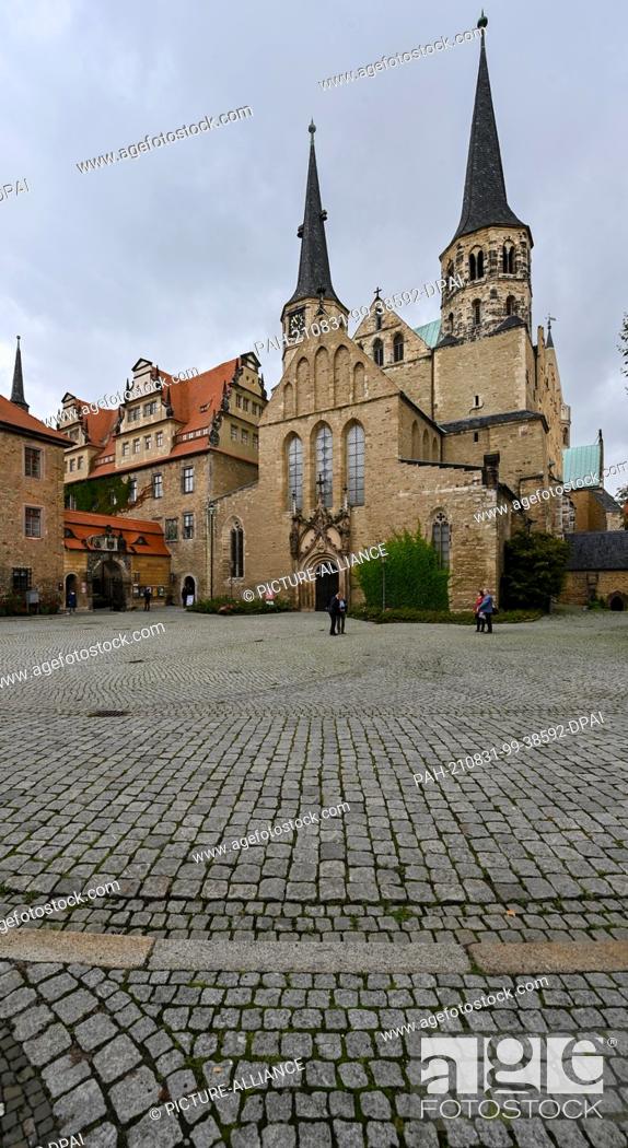 Stock Photo: 31 August 2021, Saxony-Anhalt, Merseburg: The towers of the cathedral are among the landmarks of the city of Merseburg. The cathedral organ with its baroque.