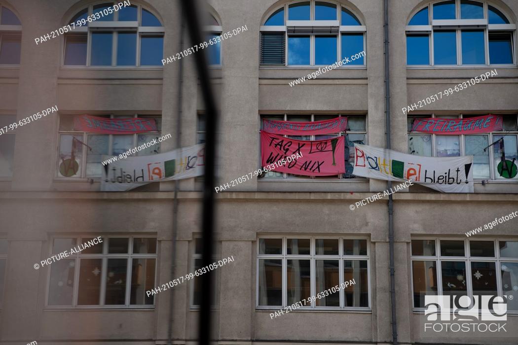 Stock Photo: 17 May 2021, Berlin: Banners hang on the building that houses the Potse youth center. Almost at the last minute, the threatened eviction of the center in.