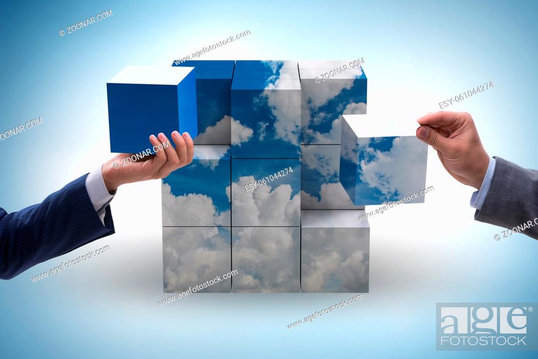 Stock Photo: Businessman building cloud cube with the shapes.