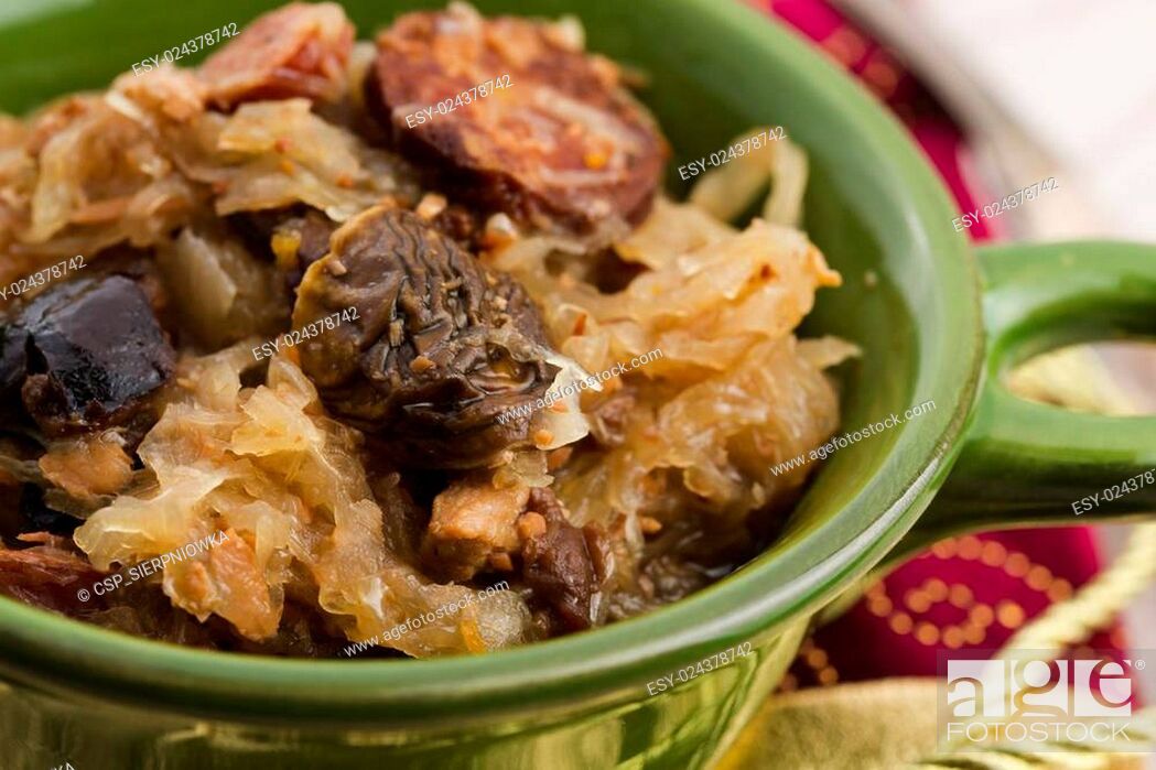 Stock Photo: traditional polish sauerkraut (bigos) with mushrooms and plums.