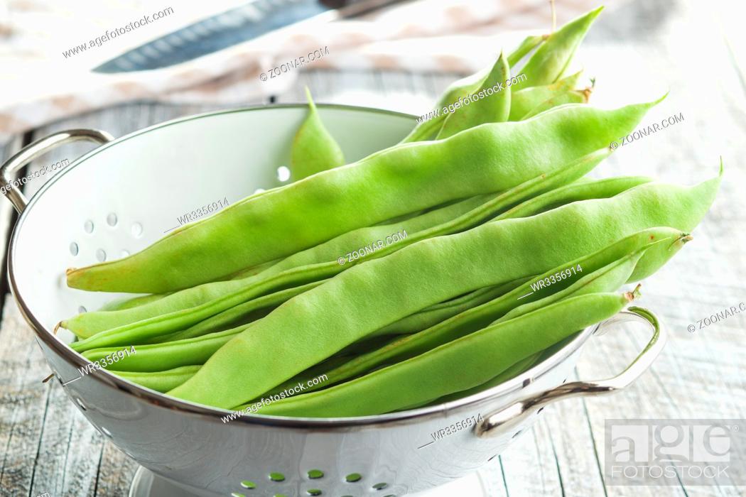 Stock Photo: Green string beans pods in colander.