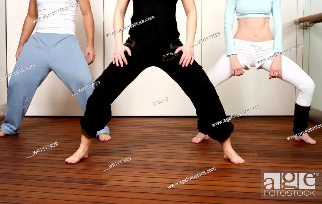 Stock Photo: Young Adult, Warming Up, Self-Defence, Wellbeing, Color Image, Fitness, Health, Healthy, Man, One, People, Sport, Adult, Caucasian Appearance, Leisure, Motion, Woman, Horizontal, Dancing, Group, Indoors, Interior, Three, Hobby, Student, Training, Workout, Tone, Black, Learning