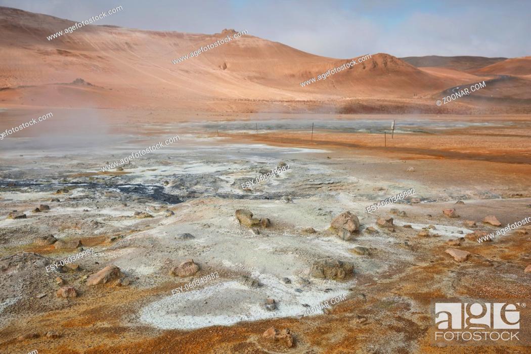 Stock Photo: Námaskarð. Fumarole field in Namafjall, Iceland. Namaskard geothermal beauty landscape with mud pools and steam. Icelandic brown landscape.