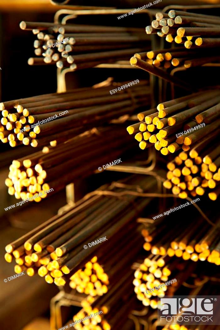 Stock Photo: close up of yellow iron rods in storehouse.