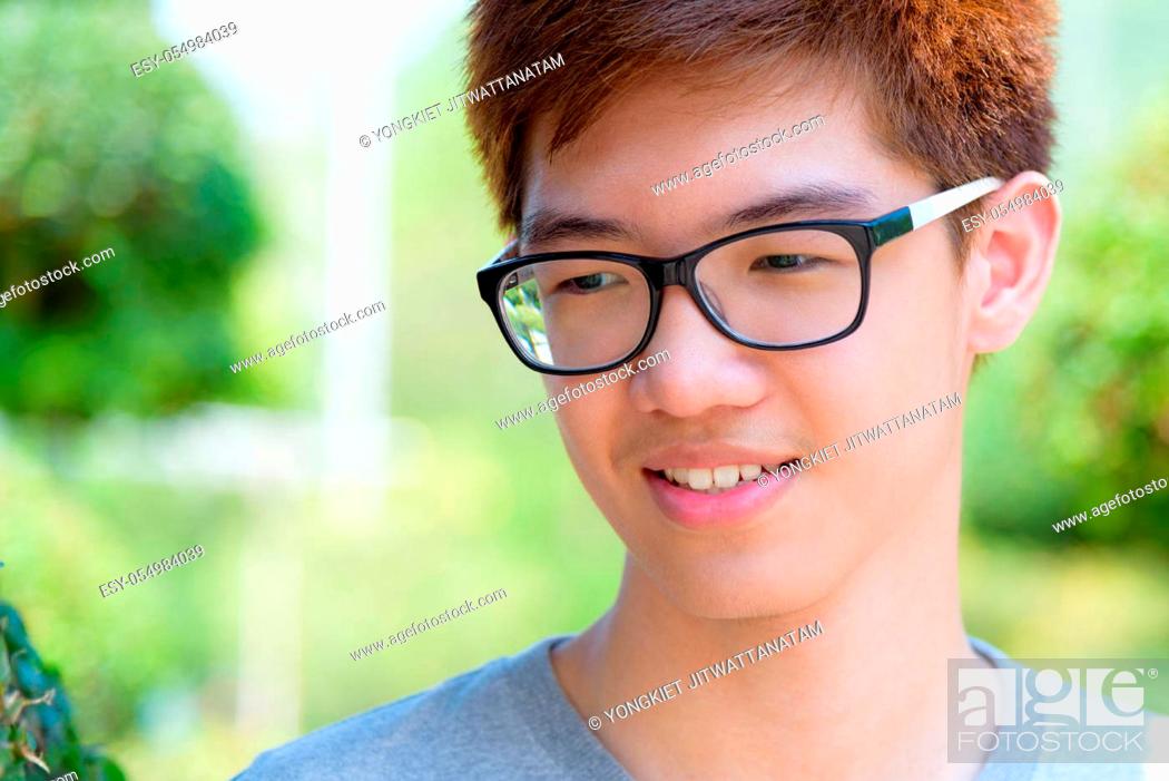 Closeup face Asian handsome teenage boy wearing glasses, Stock Photo,  Picture And Low Budget Royalty Free Image. Pic. ESY-054984039 | agefotostock