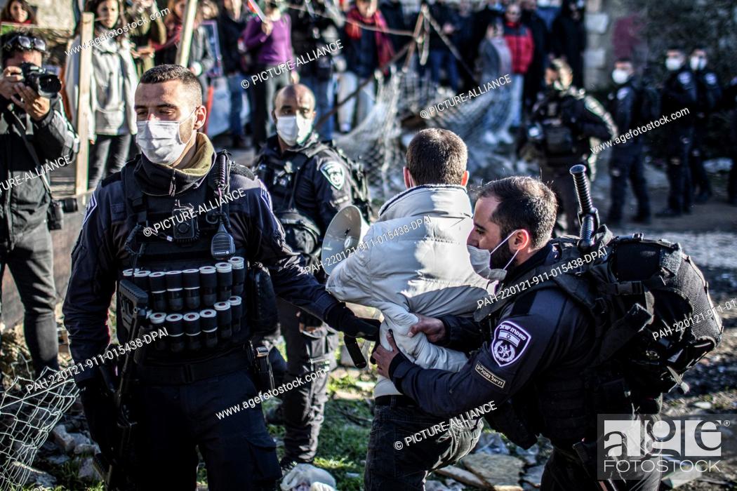 Stock Photo: 21 January 2022, Israel, Jerusalem: Israeli Police scuffle with Palestine and Israeli activists during the weekly protests in support of Palestinian families at.