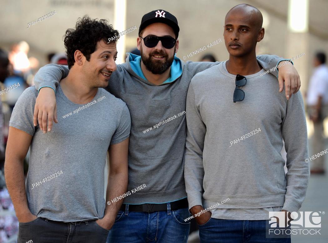 Stock Photo: Actor Fahri Yardim, rapper Paul 'SIDO' Wuerdig, and actor Tedros Teclebrhan (L-R) pose during filming for the movie Halbe Brueder in Cologne, Germany.