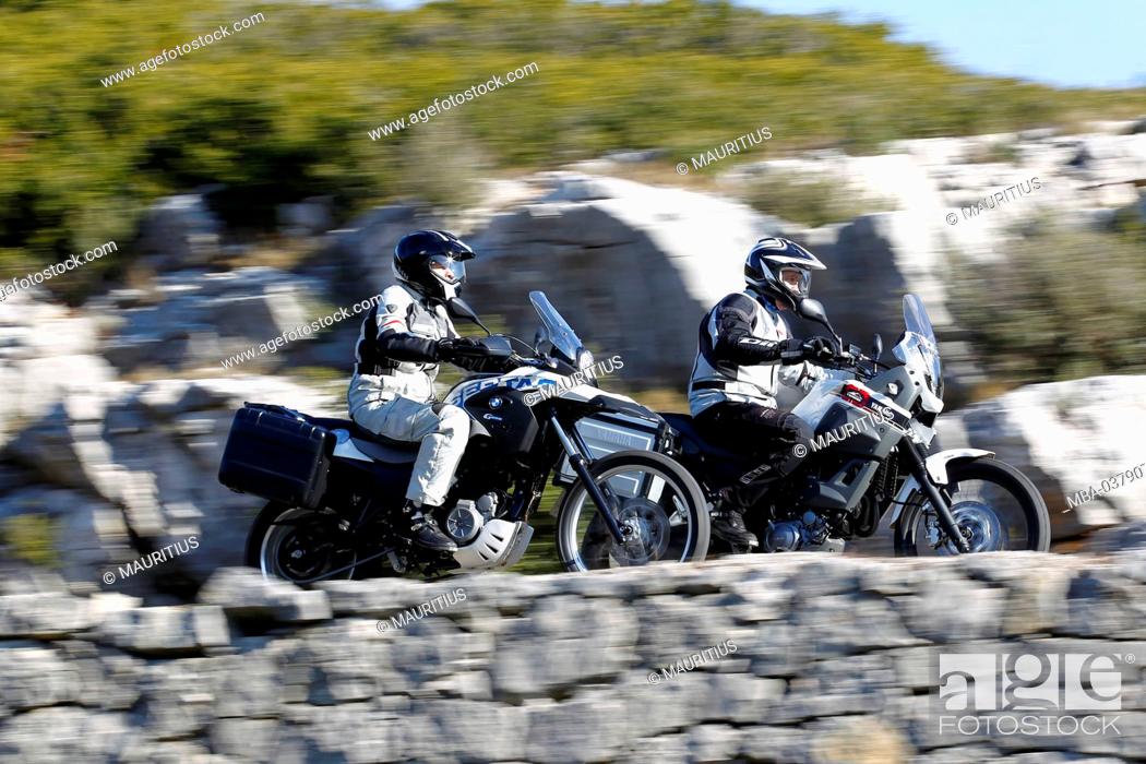 Imagen: 2 motorcycles, single cylinder Enduros, Yamaha Tenere and BMW G 650 GS, moving, Southern France, Mediterranean Sea, year of construction in 2012,.