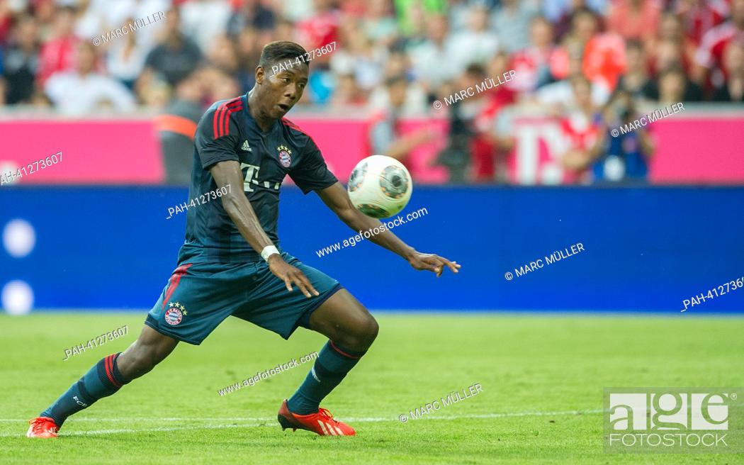 Stock Photo: Munich's David Alaba plays the ball during the test match Uli Hoeness Cup FC Bayern Munich vs FC Barcelona at the Allianz Arena in Munich, Germany, 24 July 2013.