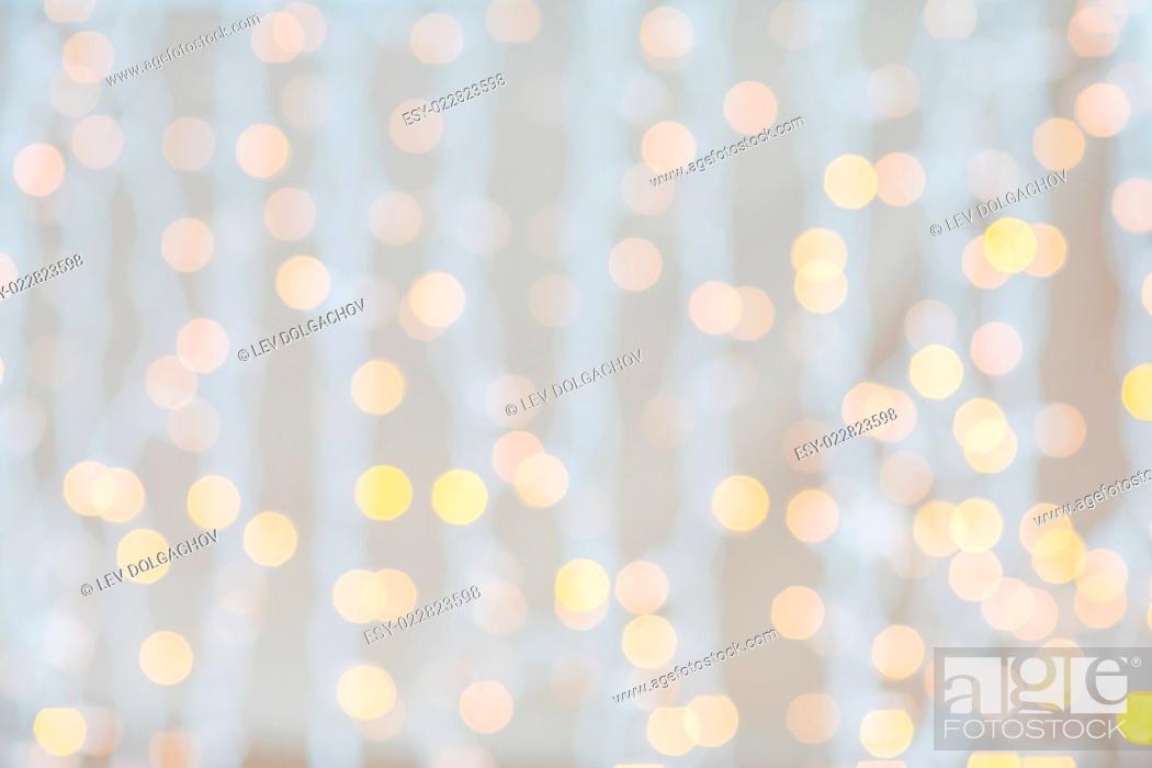 Stock Photo: holidays, party and celebration concept - blurred glden lights background.
