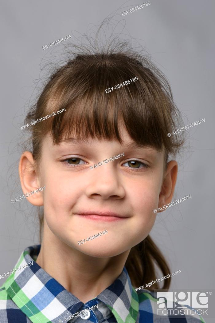 Stock Photo: Portrait of a self-confident ten-year-old girl of European appearance, close-up.