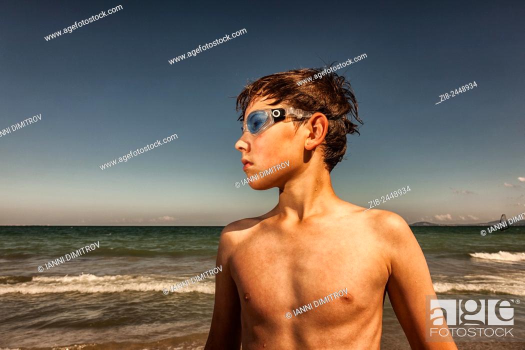 Stock Photo: Boy wearing swimming googles at seaside.
