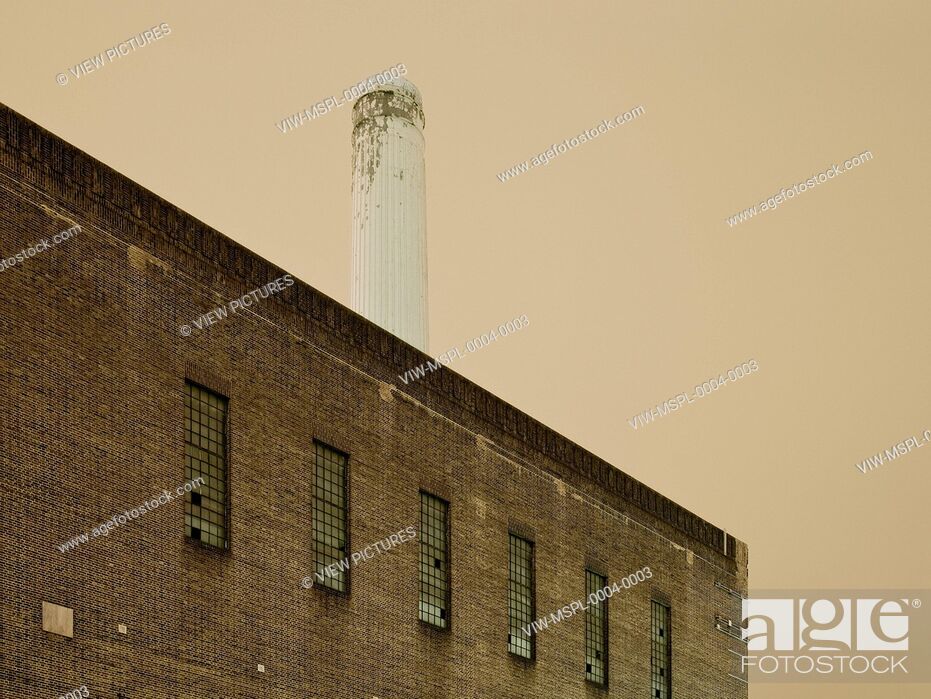 Stock Photo: Originally designed by Sir Giles Gilbert Scott and constructed in 1933, Battersea Power Station was eventually closed down due t.