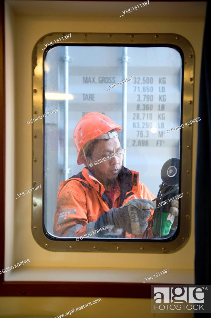 Stock Photo: An Indonesian seaman or sailor on the container-vessel MV Flintercape, during a journey from Rotterdam, Netherlands, to Sundsvall, Sweden.