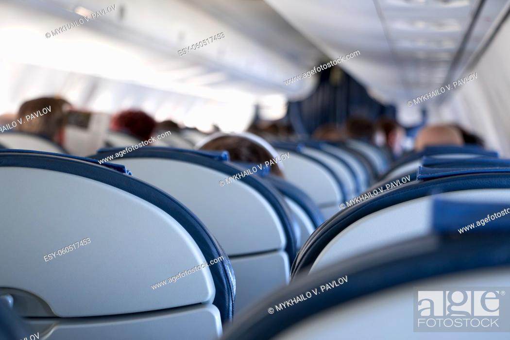 Stock Photo: The passenger compartment of a small airplane. A lot of empty seats.