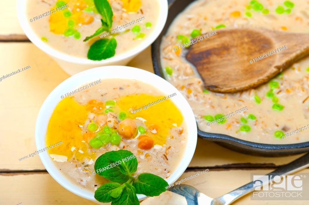 Stock Photo: Hearty Middle Eastern Chickpea and Barley Soup with mint leaves on top.