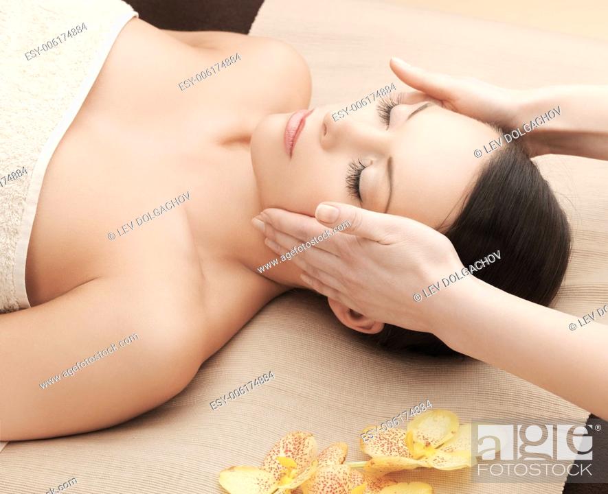 Stock Photo: health and beauty, resort and relaxation concept - asian woman in spa salon getting massage.